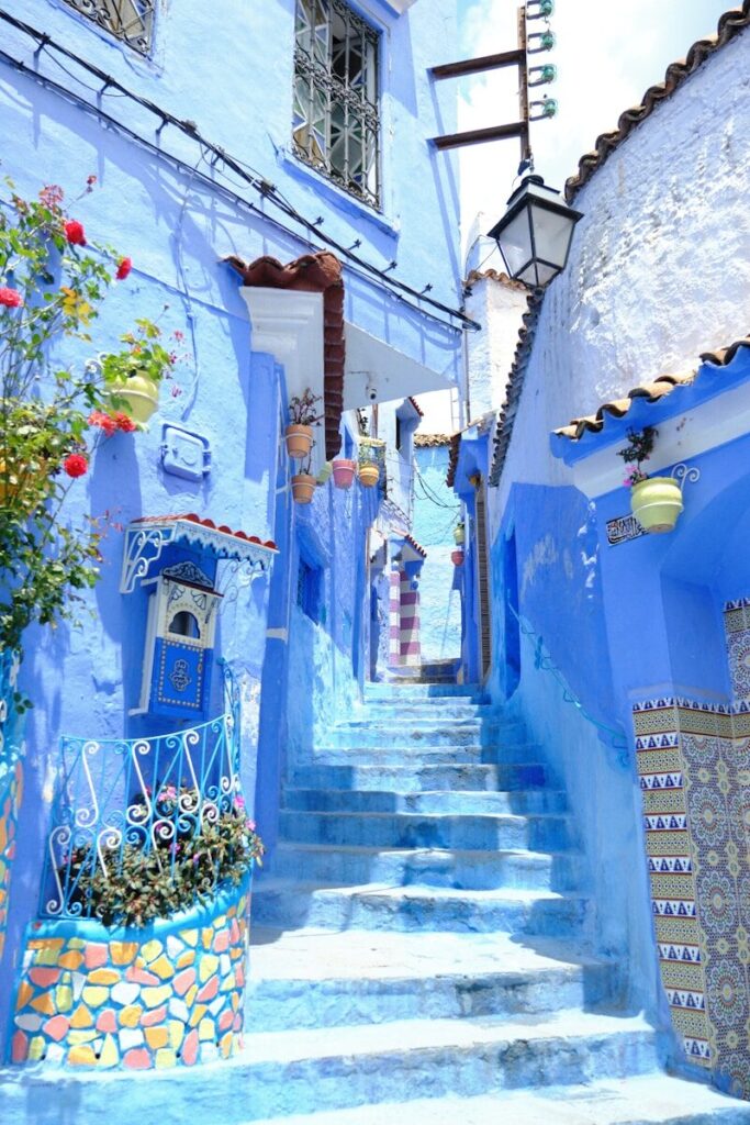 a set of steps leading up to a blue building