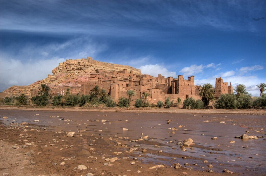 a large brown building sitting on top of a hill